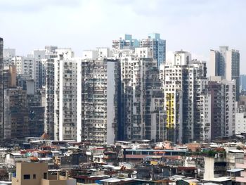 High angle view of buildings in city against sky