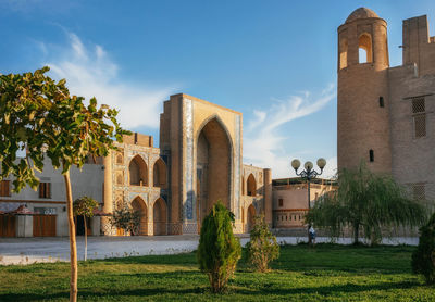 Panoramic view of trees and buildings against sky