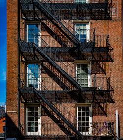 Low angle view of fire escape and building exterior