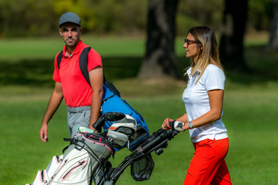 Golfing couple enjoying a game on a golf course