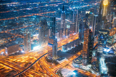 High angle view of illuminated cityscape at night