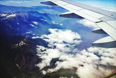 Cropped image of airplane over landscape