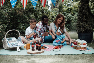 Group of people sitting on table