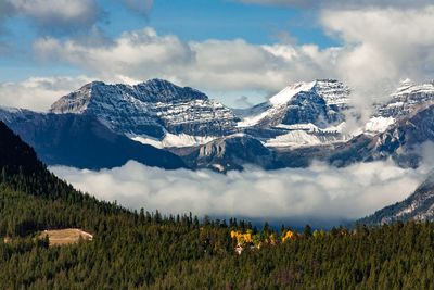 Panoramic shot of snowcapped mountains against sky