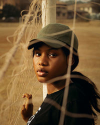 Portrait of young woman looking away outdoors