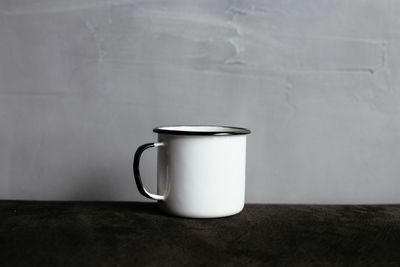 Close-up of coffee cup on table