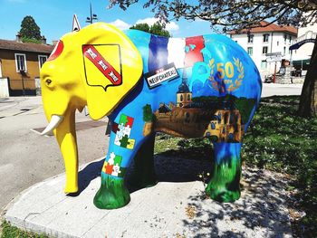 Close-up of multi colored animal representation on street