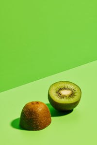 Close-up of oranges against green background