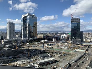 High angle view of buildings in city against sky