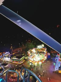 High angle view of illuminated ferris wheel at night