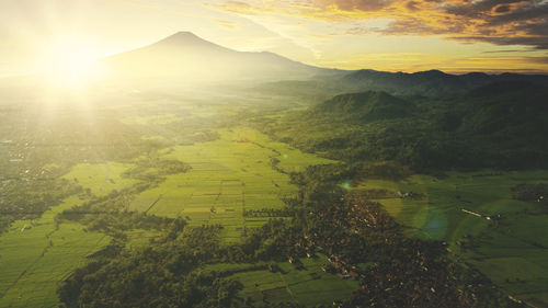 Scenic view of landscape against sky during sunset