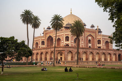 Group of people in front of historical building