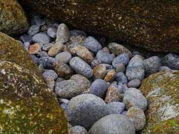 Close-up of pebbles in sea