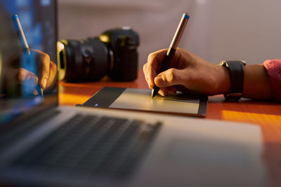 Man using laptop on table