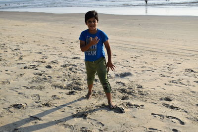 Full length of boy on beach