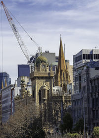 Buildings in city against sky