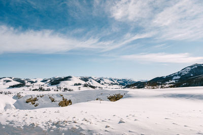 Scenic view of snowcapped mountains against sky