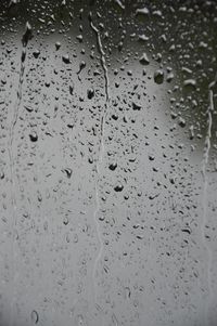 Full frame shot of raindrops on glass