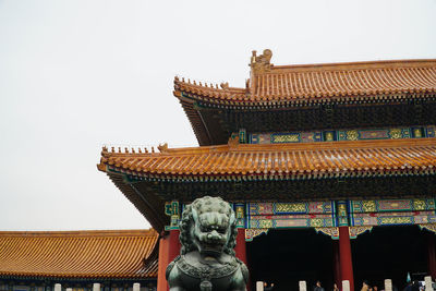 Low angle view of temple against building