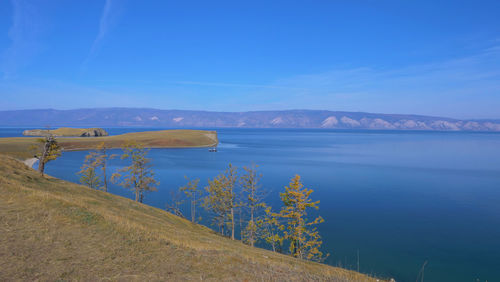 Scenic view of lake against blue sky