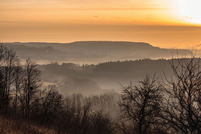 Scenic view of landscape against sky during sunset