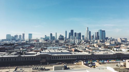 High angle view of buildings in city against sky