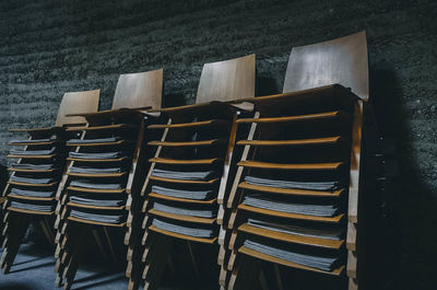 Stack of chairs against wall