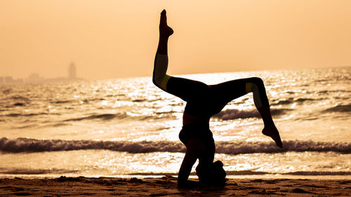 Full length of senior man at beach during sunset