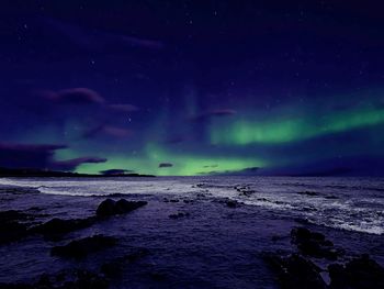 Scenic view of sea against sky at night