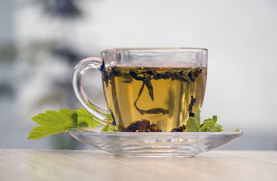 Close-up of tea in glass on table