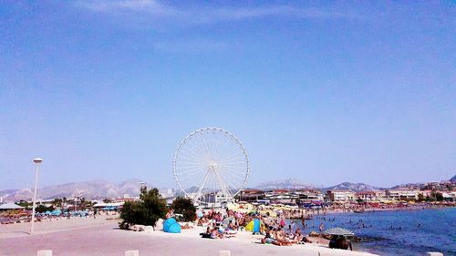 Ferris wheel against blue sky