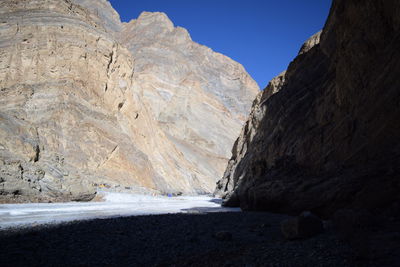 Scenic view of rocky mountains against clear sky