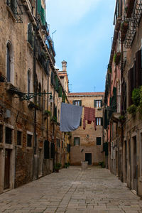 Alley amidst buildings in city