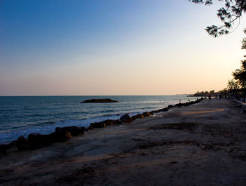 Scenic view of sea against clear sky during sunset