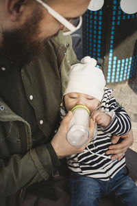 Father feeding baby