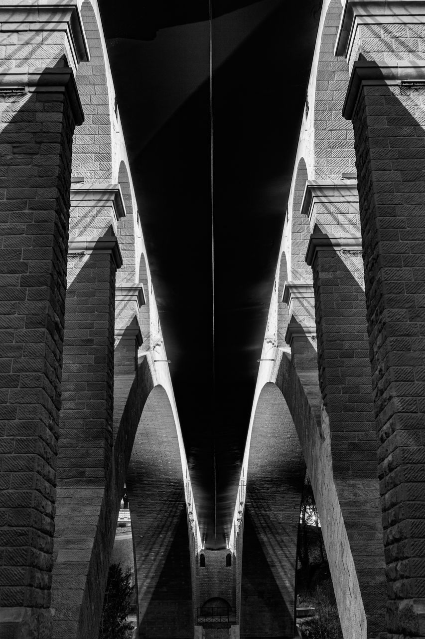 LOW ANGLE VIEW OF BRIDGE CABLES AGAINST CLOUDY SKY