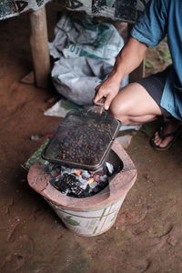 Low section of man holding ice cream