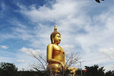 Low angle view of statue against sky
