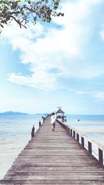 Pier over sea against sky