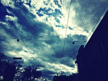 Low angle view of building against cloudy sky