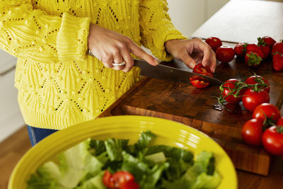Woman cutting tomatoes