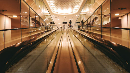 Light trails on escalator in airport