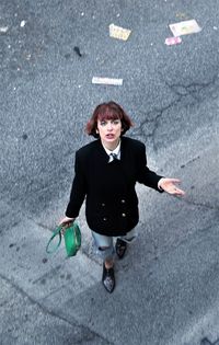 Portrait of woman standing on street