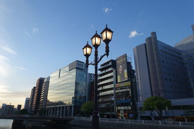 Low angle view of buildings against sky at dusk