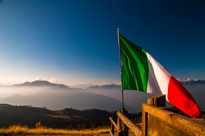 Low angle view of flag against sky