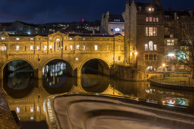 Illuminated buildings in city at night