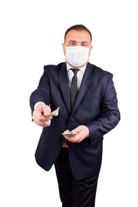 Portrait of man standing against white background