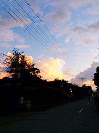 Silhouette trees against sky at sunset