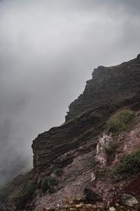 Rock formations on mountain against sky