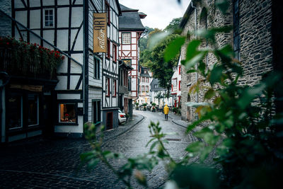 Street amidst buildings against sky